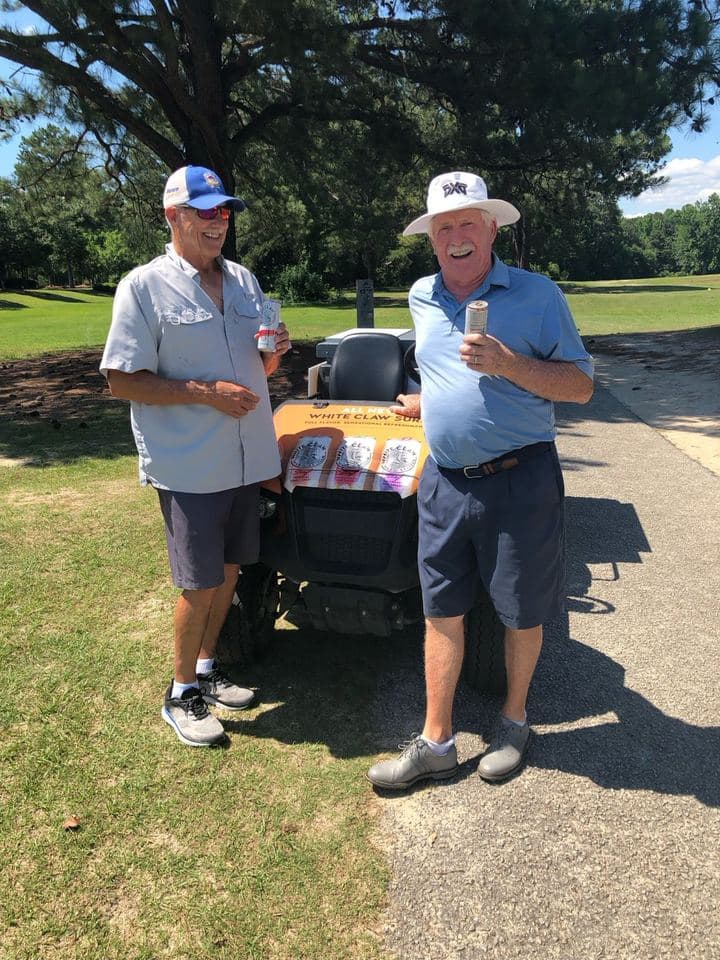 APM branded golf cart wrap at a golf course